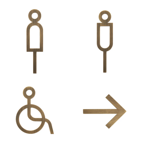 High-quality solid brass bathroom and accessibility signage in bronze, with tactile letters and symbols, designed for durability, ADA compliance, and elegant appearance in commercial or residential spaces