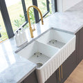 Farmhouse Double Bowl Sink 835mm White Gloss Features: Double fluted reversible farmhouse sink, crafted from fireclay and adorned with an exquisite glossy white finish. This sink offers the flexibility of showcasing either the striking fluted side or a sl
