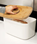 Bread Bin with Bamboo Lid Keep all your bread, rolls and pastries fresher for longer in this stylish bread bin, with a specially designed bamboo lid that doubles as a cutting board for chopping up your bread. Easy-clean storage bin with non-slip base Reve