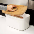 Bread Bin with Bamboo Lid Keep all your bread, rolls and pastries fresher for longer in this stylish bread bin, with a specially designed bamboo lid that doubles as a cutting board for chopping up your bread. Easy-clean storage bin with non-slip base Reve