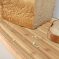 Bread Bin with Bamboo Lid Keep all your bread, rolls and pastries fresher for longer in this stylish bread bin, with a specially designed bamboo lid that doubles as a cutting board for chopping up your bread. Easy-clean storage bin with non-slip base Reve