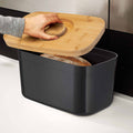 Bread Bin with Bamboo Lid Keep all your bread, rolls and pastries fresher for longer in this stylish bread bin, with a specially designed bamboo lid that doubles as a cutting board for chopping up your bread. Easy-clean storage bin with non-slip base Reve
