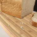 Bread Bin with Bamboo Lid Keep all your bread, rolls and pastries fresher for longer in this stylish bread bin, with a specially designed bamboo lid that doubles as a cutting board for chopping up your bread. Easy-clean storage bin with non-slip base Reve