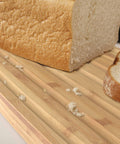Bread Bin with Bamboo Lid Keep all your bread, rolls and pastries fresher for longer in this stylish bread bin, with a specially designed bamboo lid that doubles as a cutting board for chopping up your bread. Easy-clean storage bin with non-slip base Reve