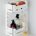Peka Sesam Mini white multi-purpose shelf system holding cleaning spray, hand soap and a dish brush