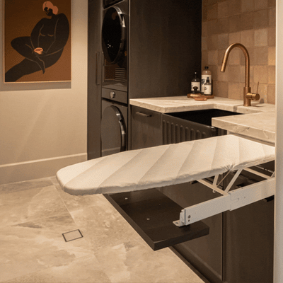 Ironfix Drawer Mounted Ironing Board Material: Steel fittingsCotton ironing board cover Finish: Powder-coated whiteWhite and grey striped cover Features: Collapsible ironing board pulls out automatically with the opening of the drawer Dimensions (L x W):