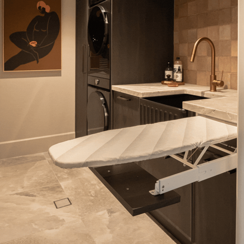 Ironfix Drawer Mounted Ironing Board Material: Steel fittingsCotton ironing board cover Finish: Powder-coated whiteWhite and grey striped cover Features: Collapsible ironing board pulls out automatically with the opening of the drawer Dimensions (L x W):