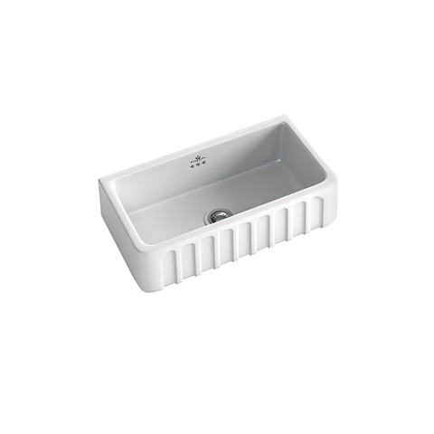 A white rectangular farmhouse sink with a ribbed front apron and a single drain, shown from an elevated angle on a solid white background.