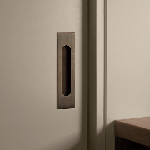 Flush solid brass cavity pull in bronze finish, recessed cabinet and drawer handle