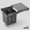 Hettich Atira Bin Set – Includes Drawer – Anthracite Upgrade your kitchen with the Hettich Atira Bin Set in Anthracite, an integrated waste solution that combines style with functionality. This premium pull-out system features the durable Atira drawer in