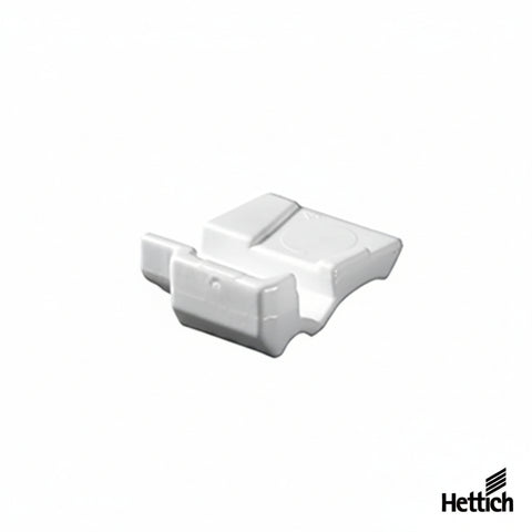 A white plastic replacement part, likely a component for a Hettich connector or fitting, shown on a plain white background with the Hettich brand logo in the bottom right corner.
