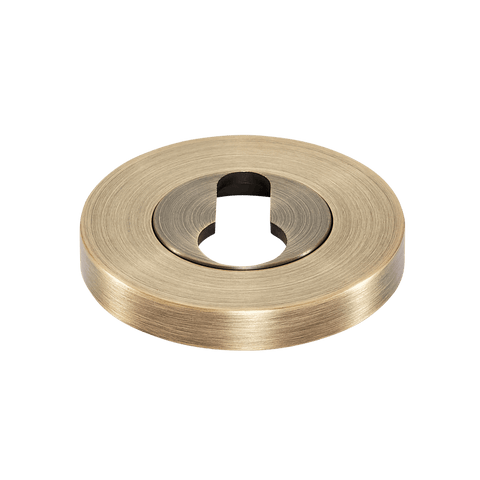 Momo Euro Cylinder Escutcheon in a sleek brass finish, ideal for enhancing door security and aesthetics.
