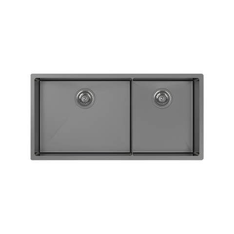 A top-down view of a dark gray double basin kitchen sink with a matte finish and integrated drain strainers, isolated on a white background.