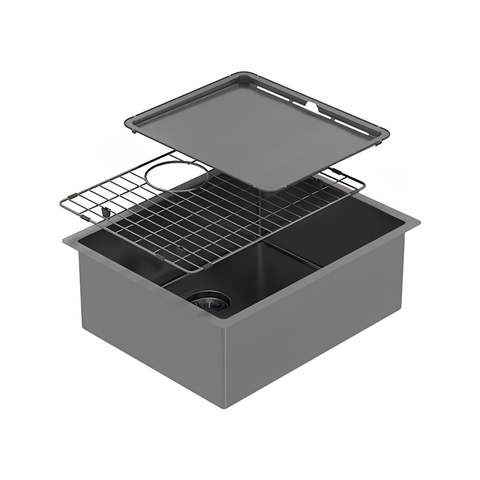 A dark gray drop-in farmhouse sink with a two-basin layout, shown with its matching dark gray drain cover and wire drying rack lifted above the basin, set against a plain white background.