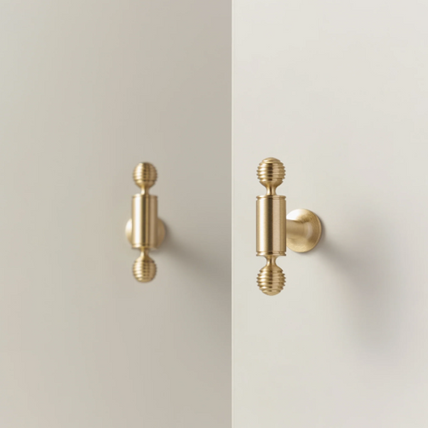 Renzo solid brass handle in satin brass finish, modern minimalist cabinet and door pull with smooth texture and durable construction for kitchen or bathroom interiors.
