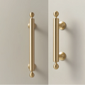 Renzo solid brass handle in satin brass finish, modern minimalist cabinet and door pull with smooth texture and durable construction for kitchen or bathroom interiors.
