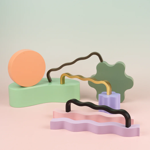 Wavey solid brass handle in satin brass finish, modern cabinet and drawer pull