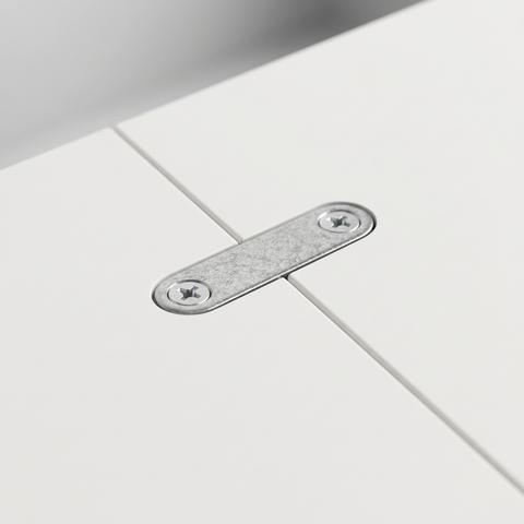 Zinc-finish joiner plate recessed across the join between two adjoining cabinet panel surfaces