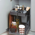 Peka Kitchen Tower anthracite lift-out caddy extended from a base cabinet with bottles, jars and utensils