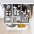 Top view of Peka Kitchen Tower caddy with compartments of spice jars, utensils and a citrus juicer