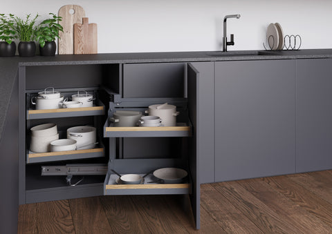 Peka Liro Magic Corner anthracite corner pull-out with oak-trimmed shelves swinging out of a dark base cabinet, holding pots and bowls
