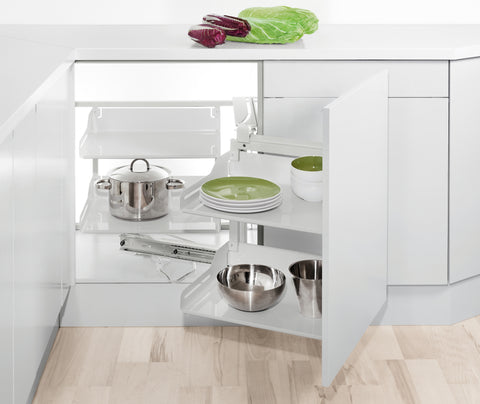 Peka Liro Magic Corner white corner pull-out with shelves extending from a corner cabinet, holding pots, plates and bowls