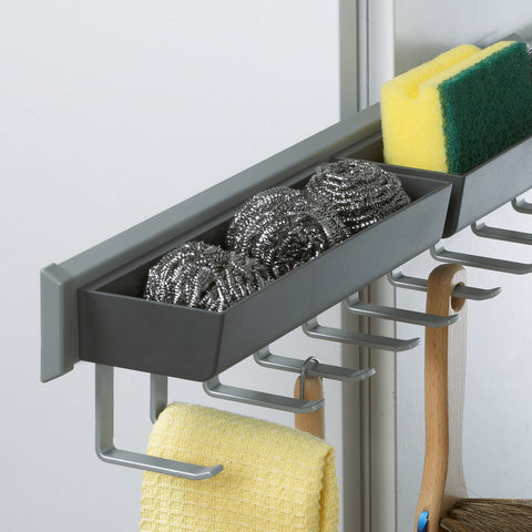 Close-up of Peka Pesolo anthracite pull-out tray and hooks holding sponges and a cleaning cloth