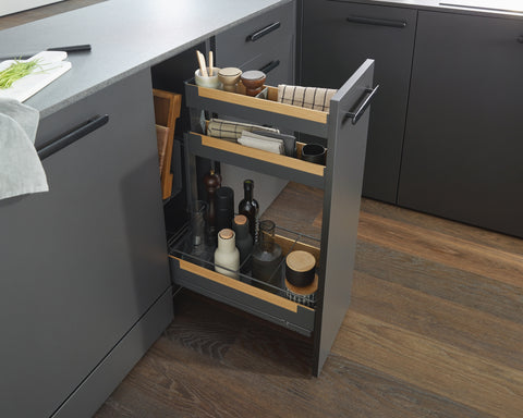 Peka Pinello Board anthracite baking tray and chopping board pull-out beside spice jars and bottles in a modern kitchen