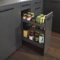 Peka Pinello Cargo base unit pull-out in anthracite, installed in a kitchen cabinet and filled with spice jars, bottles and pantry items across tiered shelves