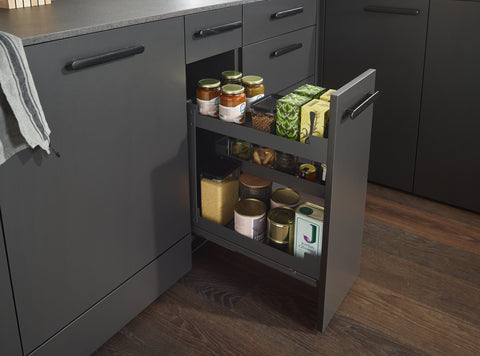 Peka Pinello Cargo base unit pull-out in anthracite, installed in a kitchen cabinet and filled with spice jars, bottles and pantry items across tiered shelves