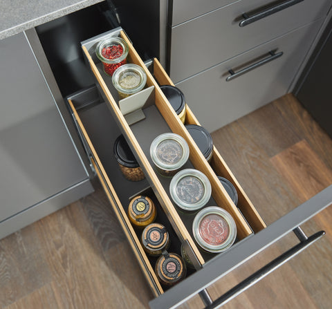 Top view of Peka Pinello Cargo anthracite kitchen base unit pull-out organising spice and condiment jars on bamboo-trimmed tiered shelves