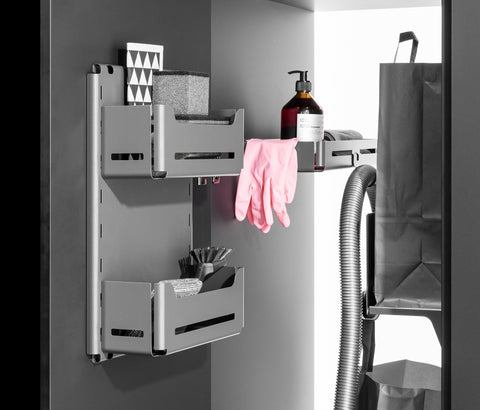 Peka Sesam Mini anthracite multi-purpose shelf system holding cleaning bottles, brushes and gloves inside a cupboard