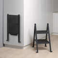 Peka Stepolo two-step folding stepladder shown folded flat against cabinetry and opened for use