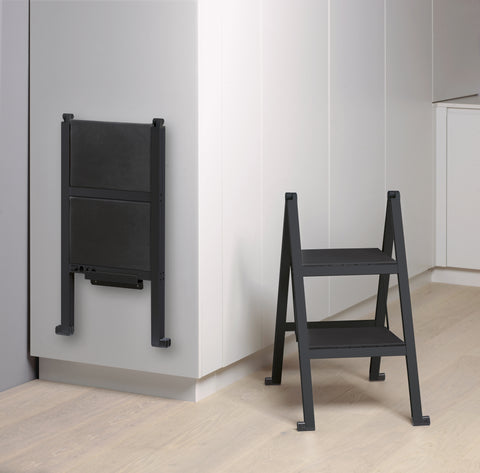 Peka Stepolo two-step folding stepladder shown folded flat against cabinetry and opened for use