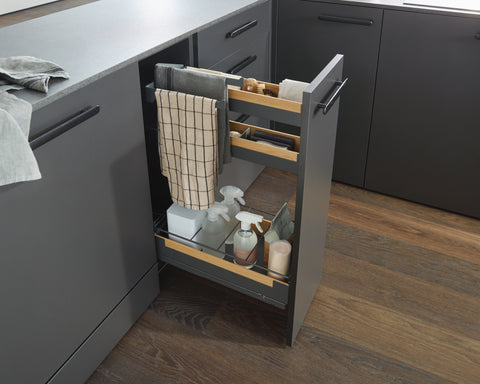 Peka Pinello Towel anthracite pull-out with towel rail and cleaning products in a dark kitchen base cabinet