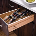 Häfele Salsa Pro spice tray fitted in an open timber kitchen drawer, holding spice jars tilted so the labels face up